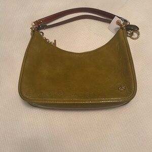 New Tori Burch Paten Leather with brass & suede lined ..